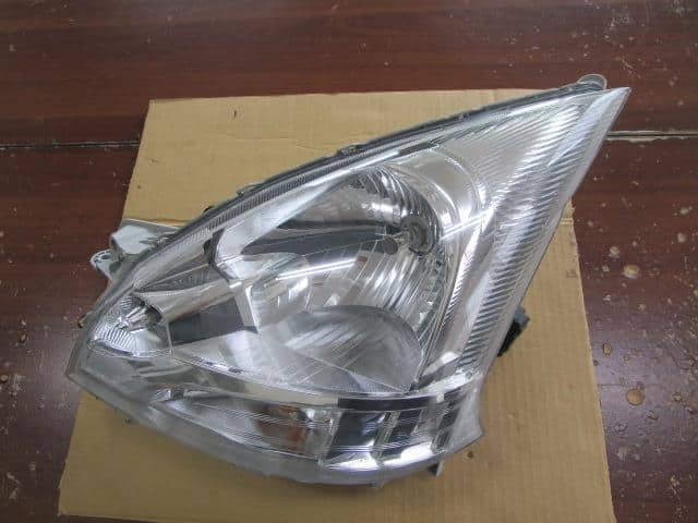 Left Headlight DAIHATSU Move 2010 DBA-LA100S — photo 1