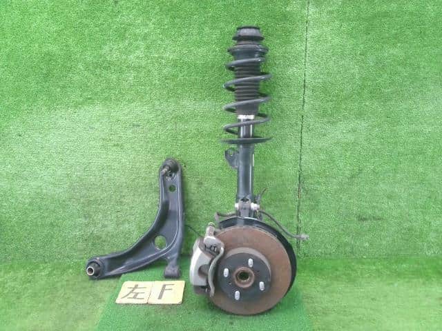 Front Left Strut Assembly TOYOTA Aqua 2014 DAA-NHP10 — photo 1