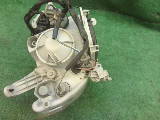 Left Headlight DAIHATSU Tanto 2009 DBA-L375S — photo 4