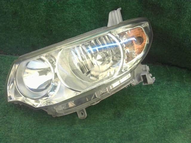 Left Headlight DAIHATSU Tanto 2009 DBA-L375S — photo 1