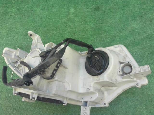 Left Headlight DAIHATSU Tanto 2009 DBA-L375S — photo 6