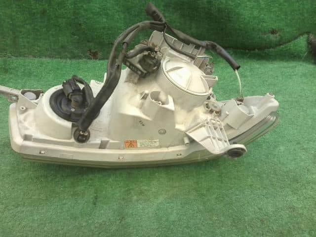 Left Headlight DAIHATSU Tanto 2009 DBA-L375S — photo 3