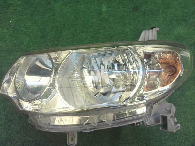 Left Headlight DAIHATSU Tanto 2009 DBA-L375S — photo 8