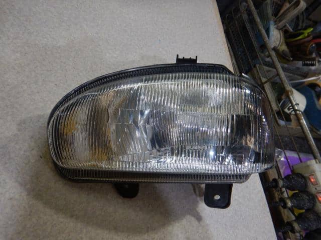 Left Headlight SUBARU Vivio 1998 E-KK4 84001KC010 — photo 1