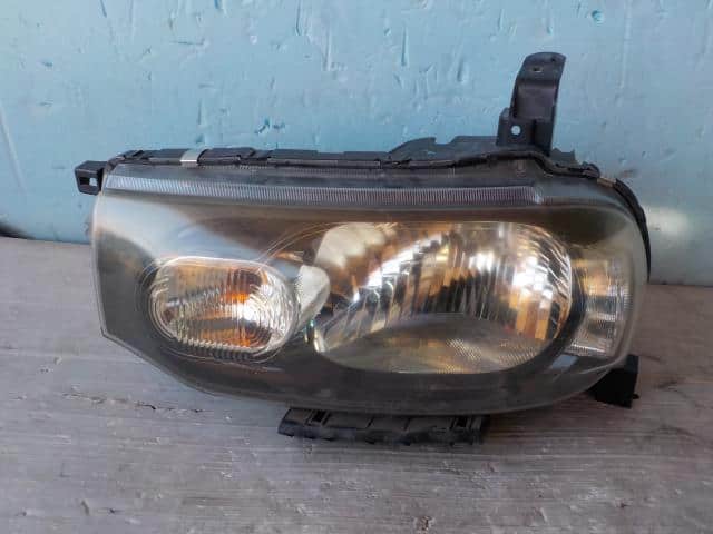 Left Headlight NISSAN Cube 2009 DBA-Z12 — photo 1