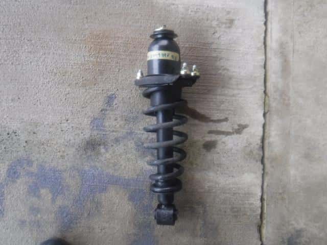 Rear Left Strut TOYOTA COROLLA 2004 CBA-NZE124 — photo 1