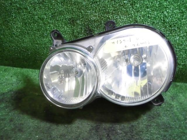 Left Headlight DAIHATSU Move 2001 TA-L910S — photo 1
