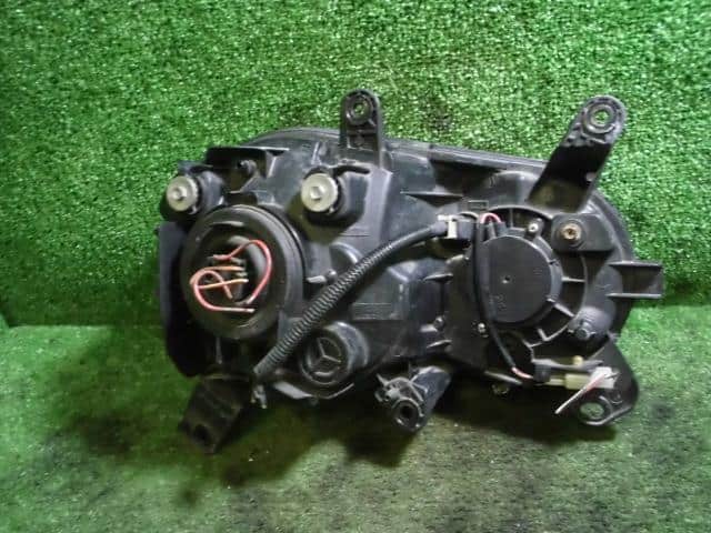 Left Headlight DAIHATSU Move 2001 TA-L910S — photo 2