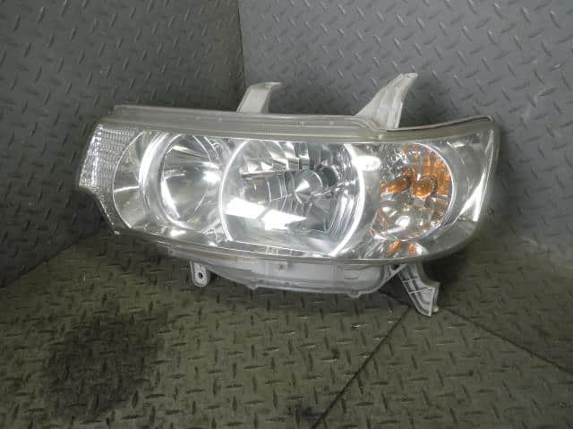 Left Headlight DAIHATSU Tanto 2005 ABA-L350S — photo 1