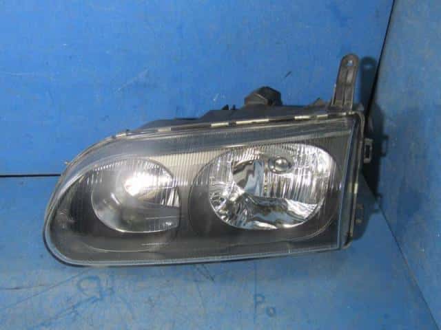 Left Headlight MITSUBISHI Delica space gear 2004 GH-PD6W — photo 1