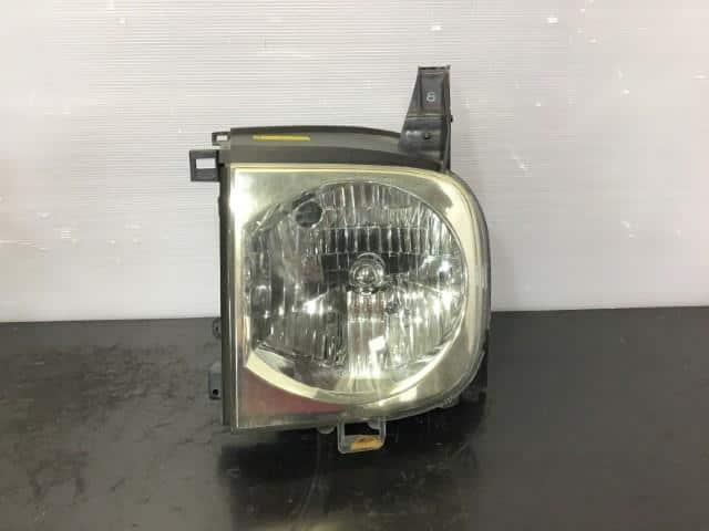 Left Headlight NISSAN Cube 2003 UA-BZ11 — photo 1