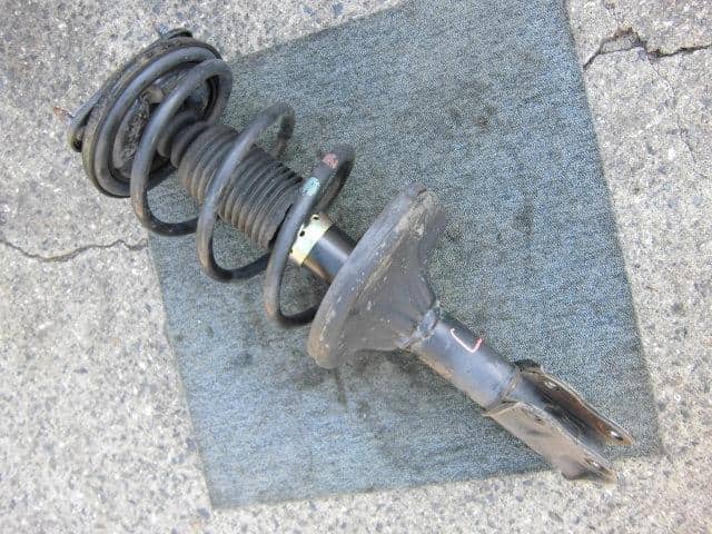 Front Left Strut MITSUBISHI Lancer Cedia 2002 TA-CS5W — photo 1
