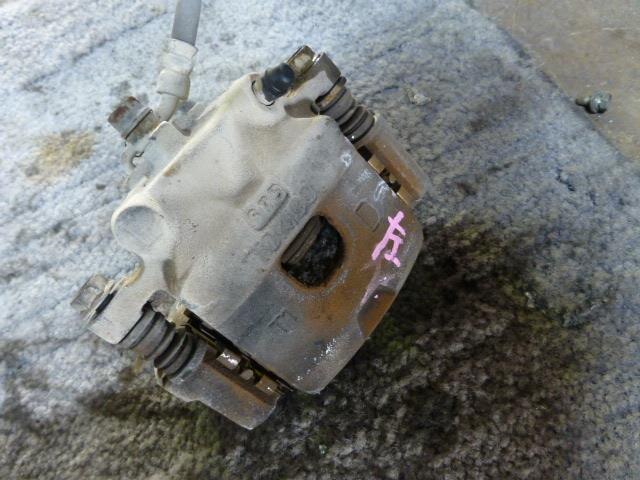 Front Left Caliper TOYOTA Passo 2006 DBA-QNC10 — photo 2