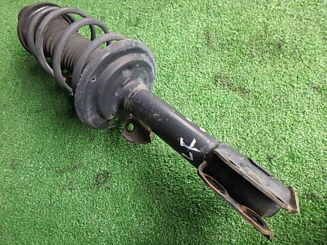 Front Left Strut TOYOTA Vitz 2006 DBA-SCP90 — photo 1