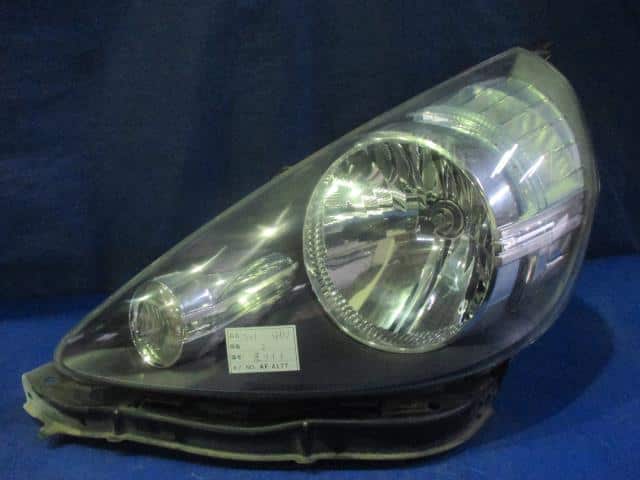 Left Headlight HONDA Fit 2005 DBA-GD1 — photo 1