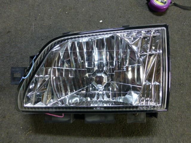 Left Headlight NISSAN Atlas 2001 KG-SR4F23 — photo 1