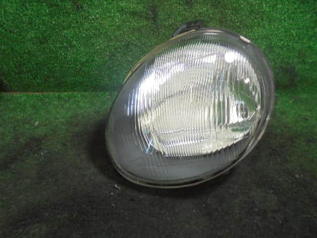 Left Headlight MITSUBISHI Minica 1997 V-H32V — photo 1