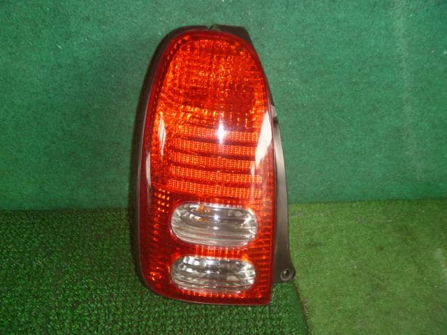 Left Tail Light DAIHATSU Mira 2002 TA-L710S 8156097235000 — photo 1