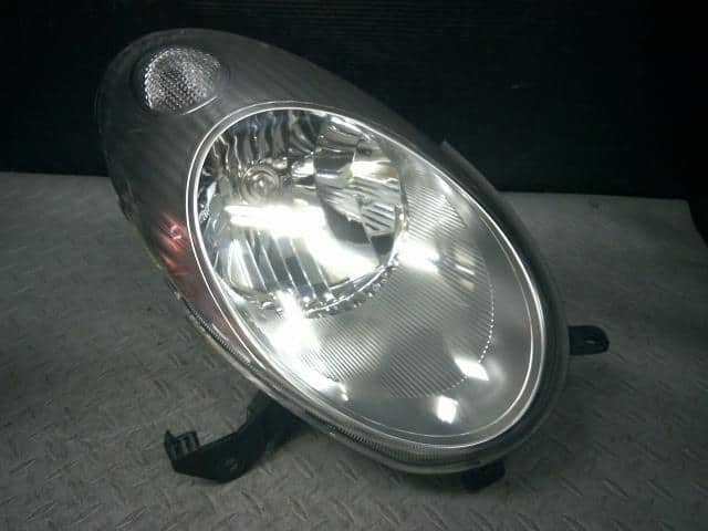 Right Headlight NISSAN March 2004 CBA-AK12 — photo 1