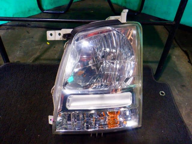 Left Headlight SUZUKI Wagon R 2004 CBA-MH21S — photo 1