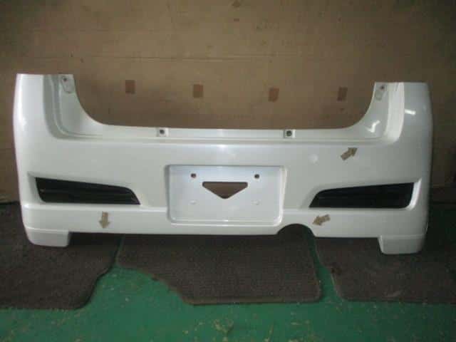 Rear Bumper Face SUBARU Stella 2006 DBA-RN2 57703KJ030WC — photo 1