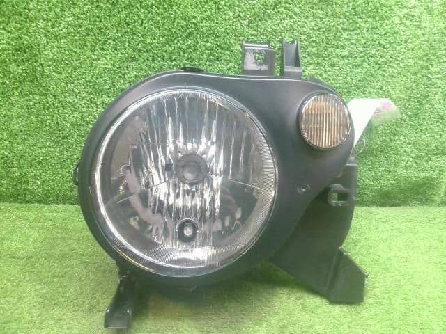 Left Headlight MAZDA Spiano 2006 TA-HF21S 1A3851041 — photo 1