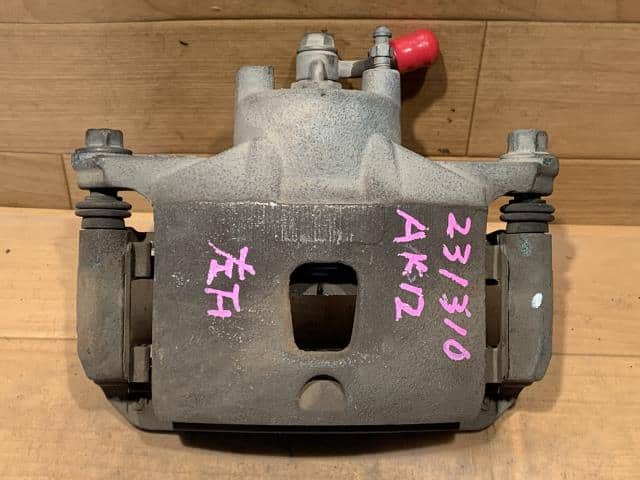 Front Left Caliper NISSAN March 2003 UA-AK12 — photo 1