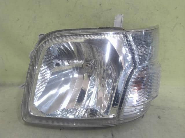 Left Headlight DAIHATSU Hijet 2010 EBD-S331V — photo 1