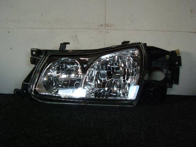Left Headlight NISSAN Prairie Liberty 1999 GF-PM12 — photo 1