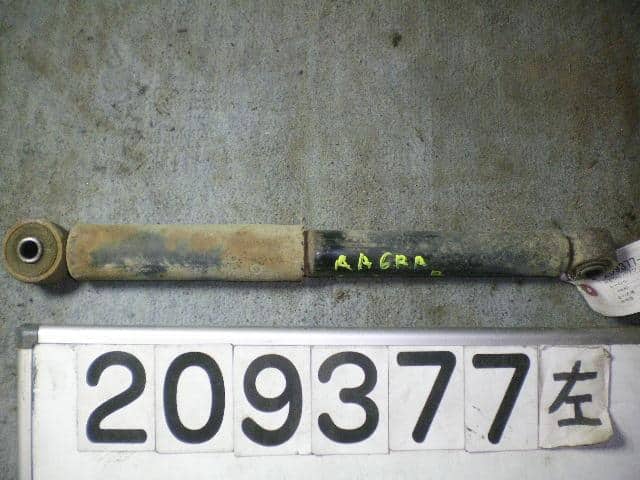 Rear Left Shock Absorber MAZDA Carol 1995 E-AA6RA A01128700A — photo 2