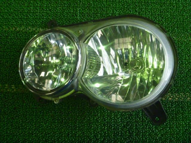 Left Headlight DAIHATSU Move 2000 TA-L900S — photo 1
