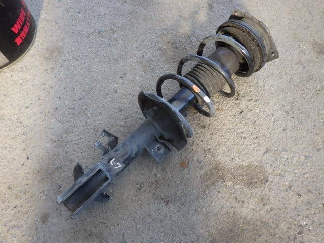 Front Left Strut NISSAN Cube 2006 DBA-YGZ11 — photo 1