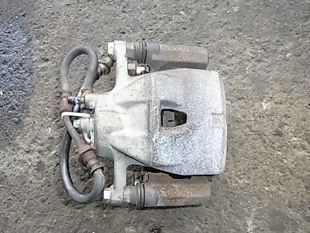Front Left Caliper TOYOTA Vitz 2005 DBA-SCP90 — photo 1