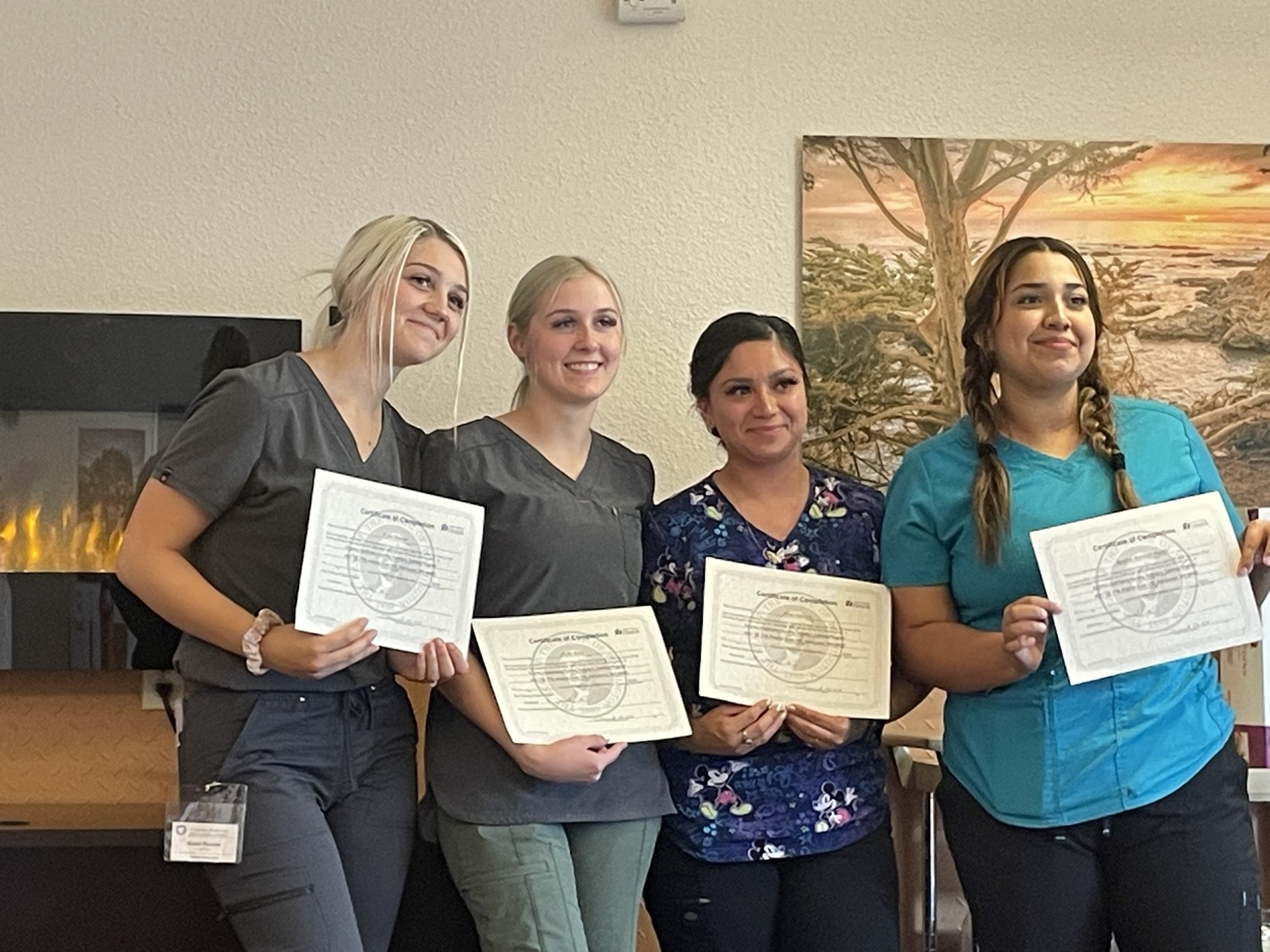 One of our centers celebrating their NEW certified nursing assistants as they completed the in-house  CNA class.