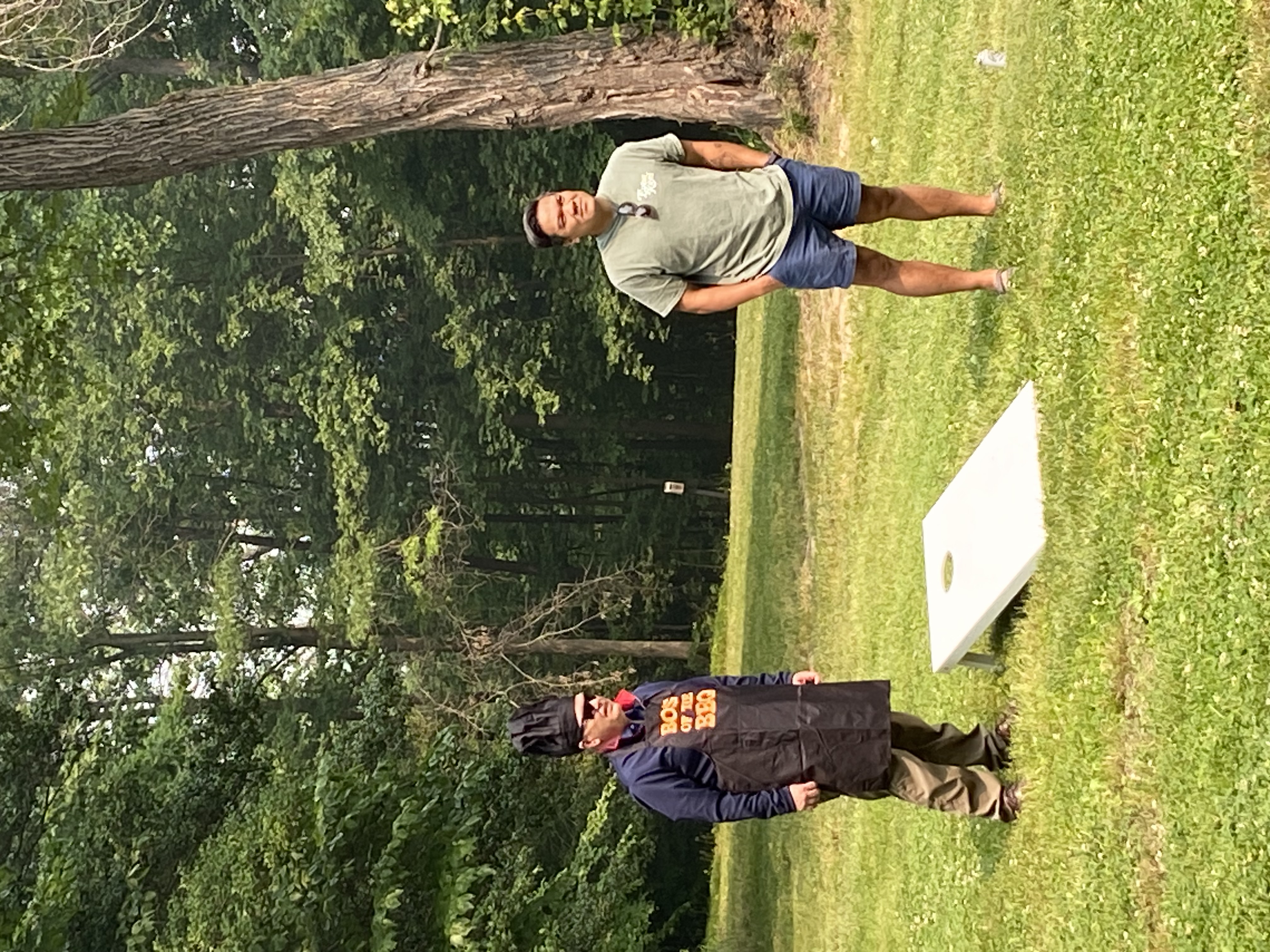 Boss of the BBQ - also known as the CEO - participating in cornhole competition at the Summer Outing.