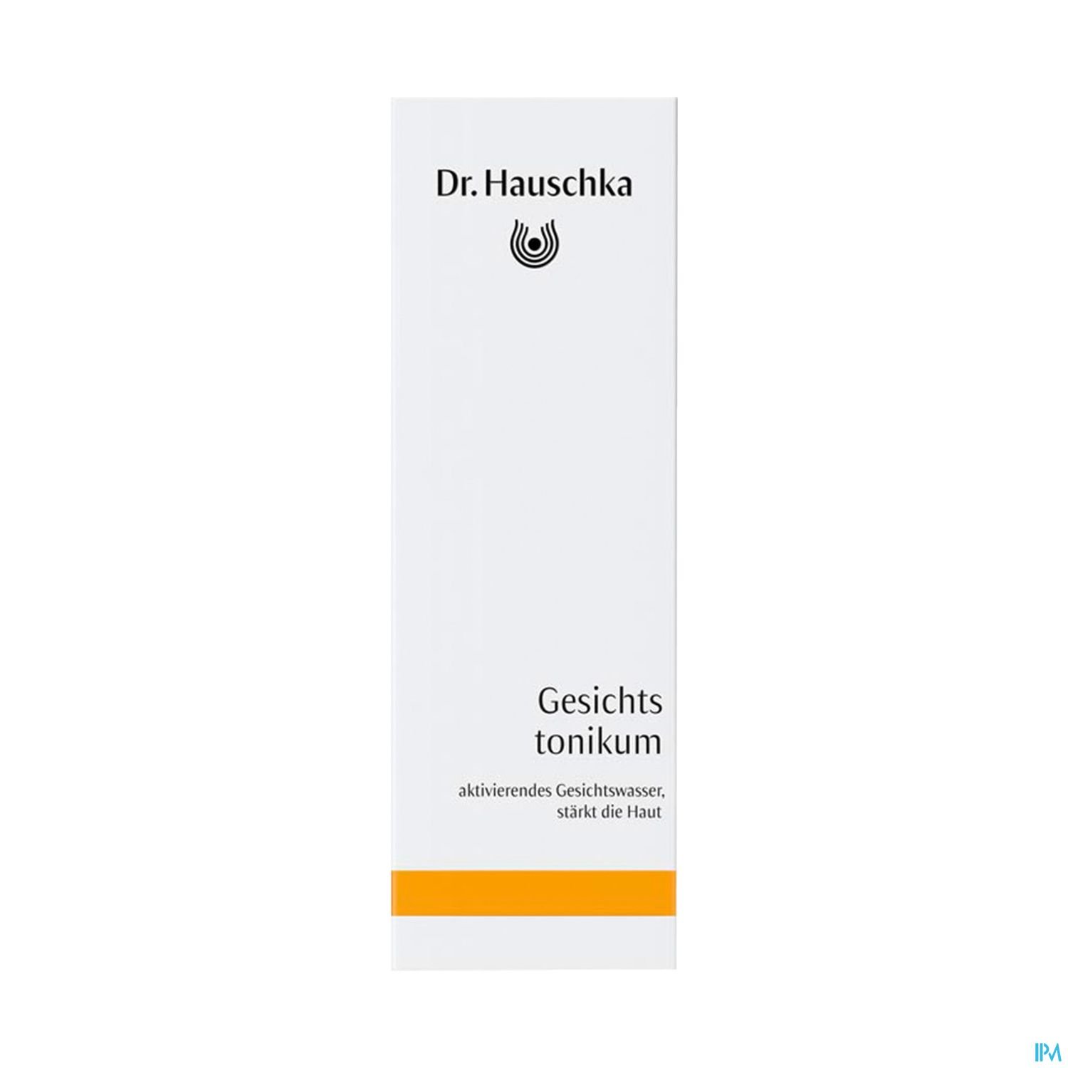 Produktverpackung von Dr. Hauschka Gesichts-Tonikum, weiß mit orangefarbenem Streifen und schwarzem Logo.