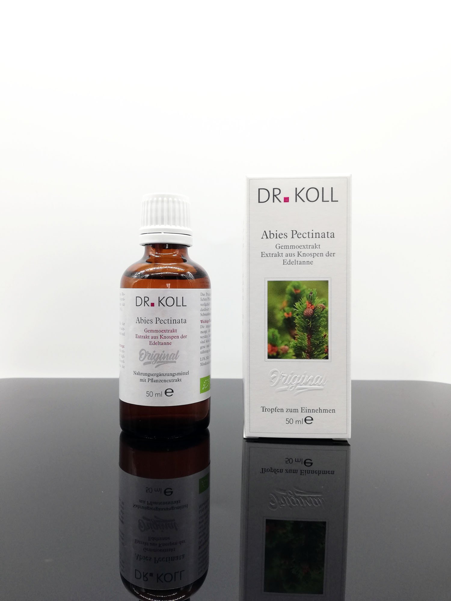 Braunglasflasche mit Tropfen von Dr. Koll und Verpackung mit der Aufschrift "Abies Pectinata".