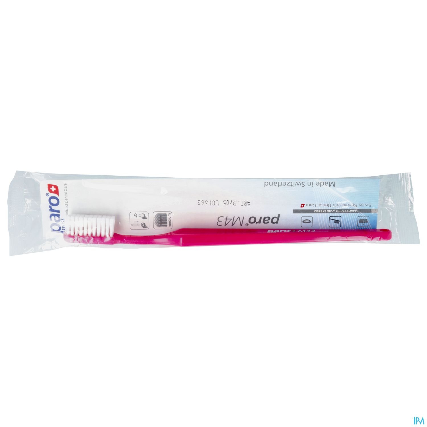 Zahnbürste mit pinkem Griff in Verpackung.