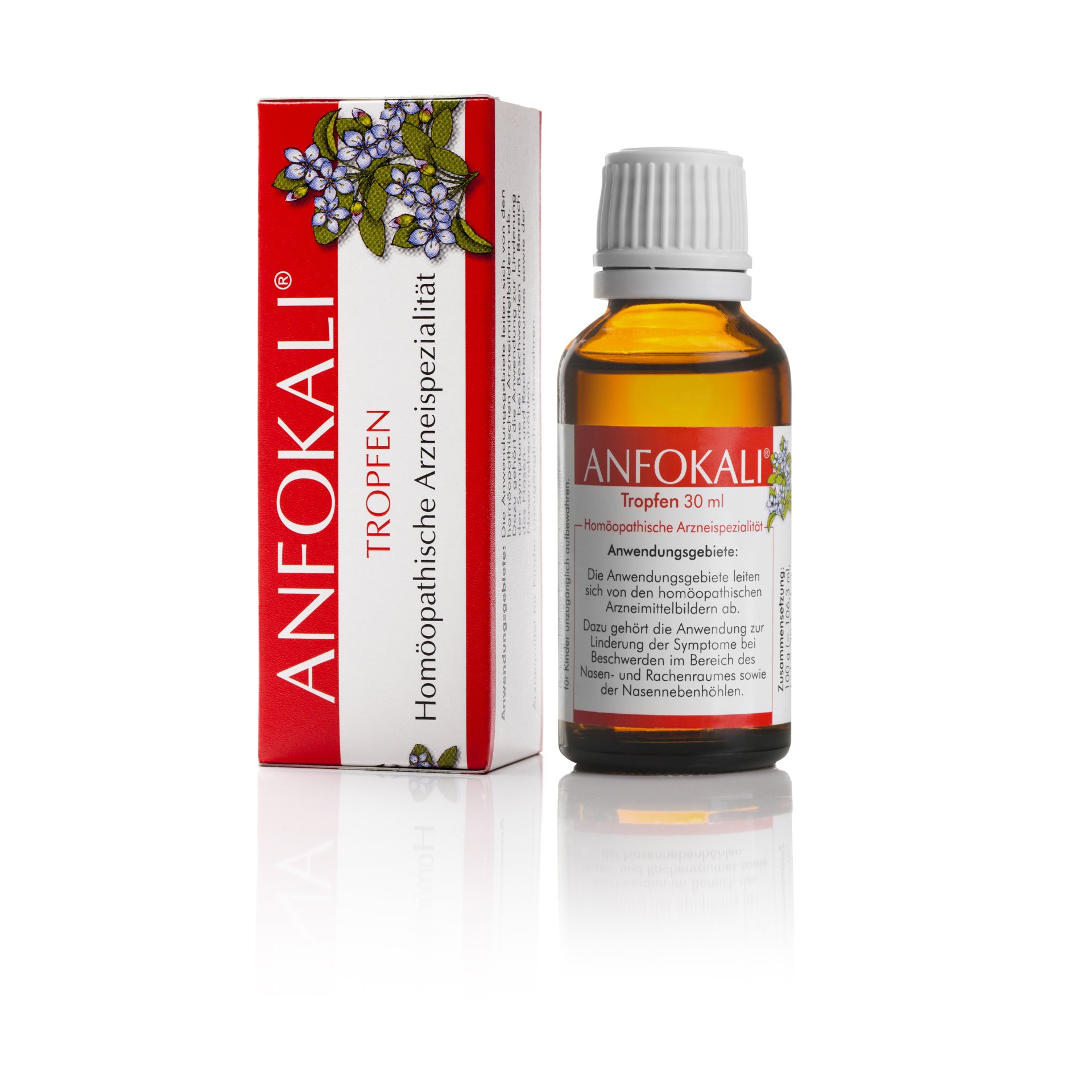 Braunglasflasche mit homöopathischen Tropfen, daneben die Verpackung mit roten und weißen Schriftzügen.