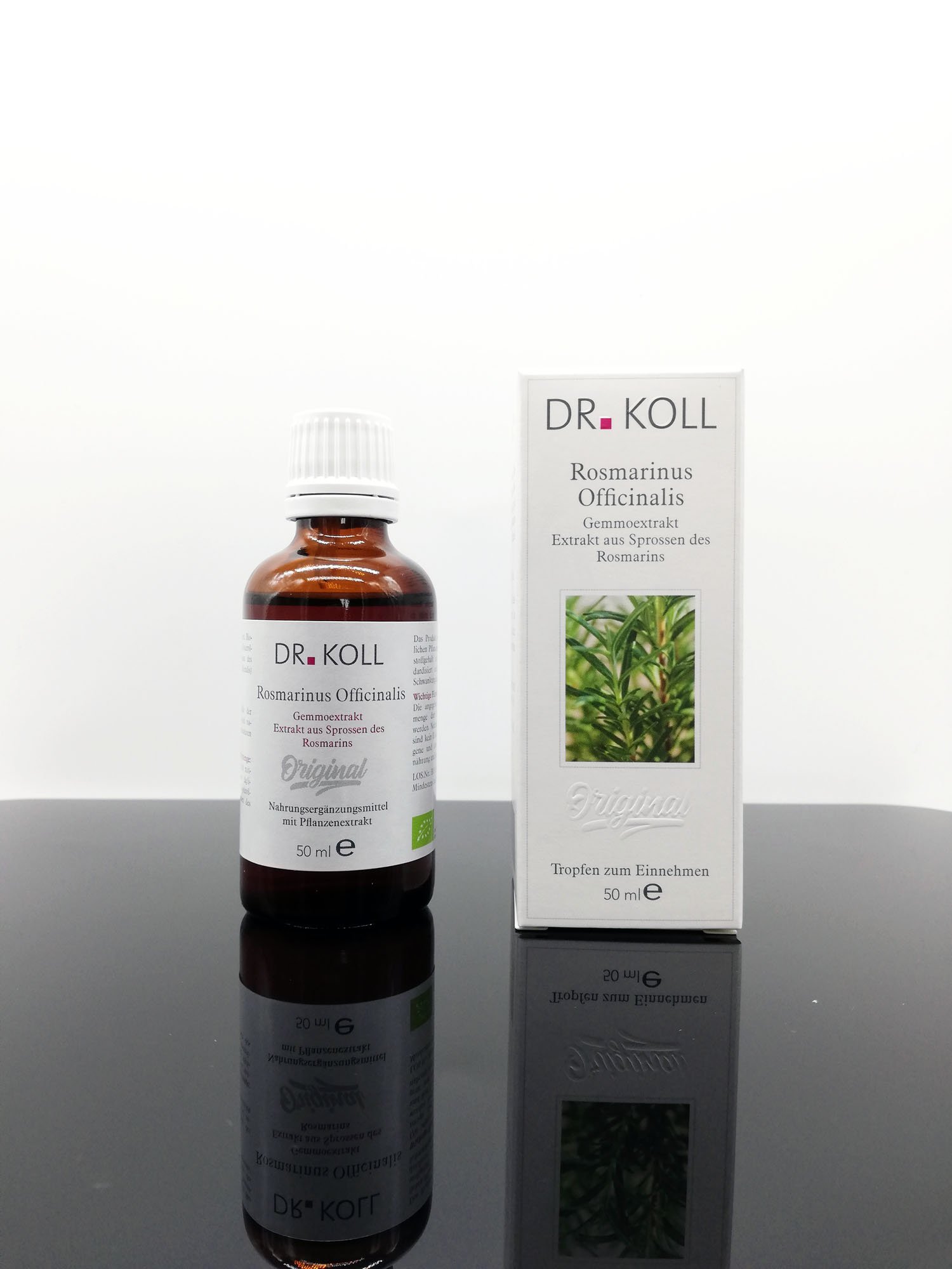 Braune Flasche mit der Aufschrift "Dr. KOLL Rosmarinus Officinalis" steht neben einer weißen Verkaufsverpackung mit derselben Beschriftung und einem Bild von Rosmarin.