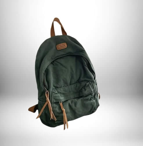 Sac à dos en coton vert foncé avec fermeture à glissière, pochette, garnitures et poignées en cuir brun clair