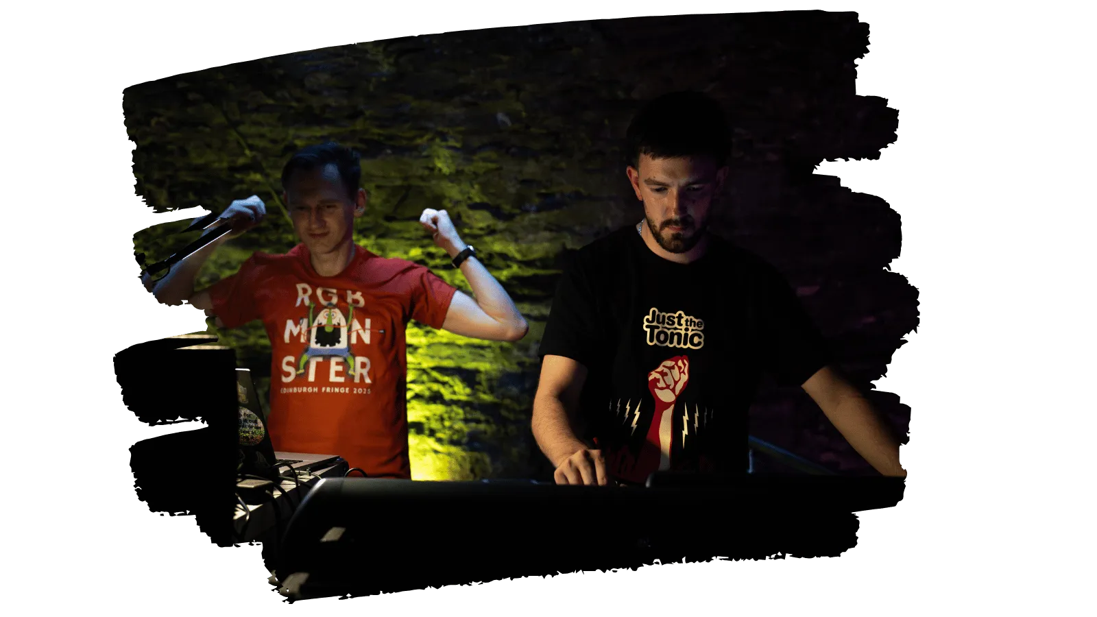 Two techs making sure the show goes on smoothly. One is at the sound desk while the other one is looking at his laptop. Not exactly sure what he is holding in his right hand but he seems rather happy (it's hard to tell, really, because it's Tom)