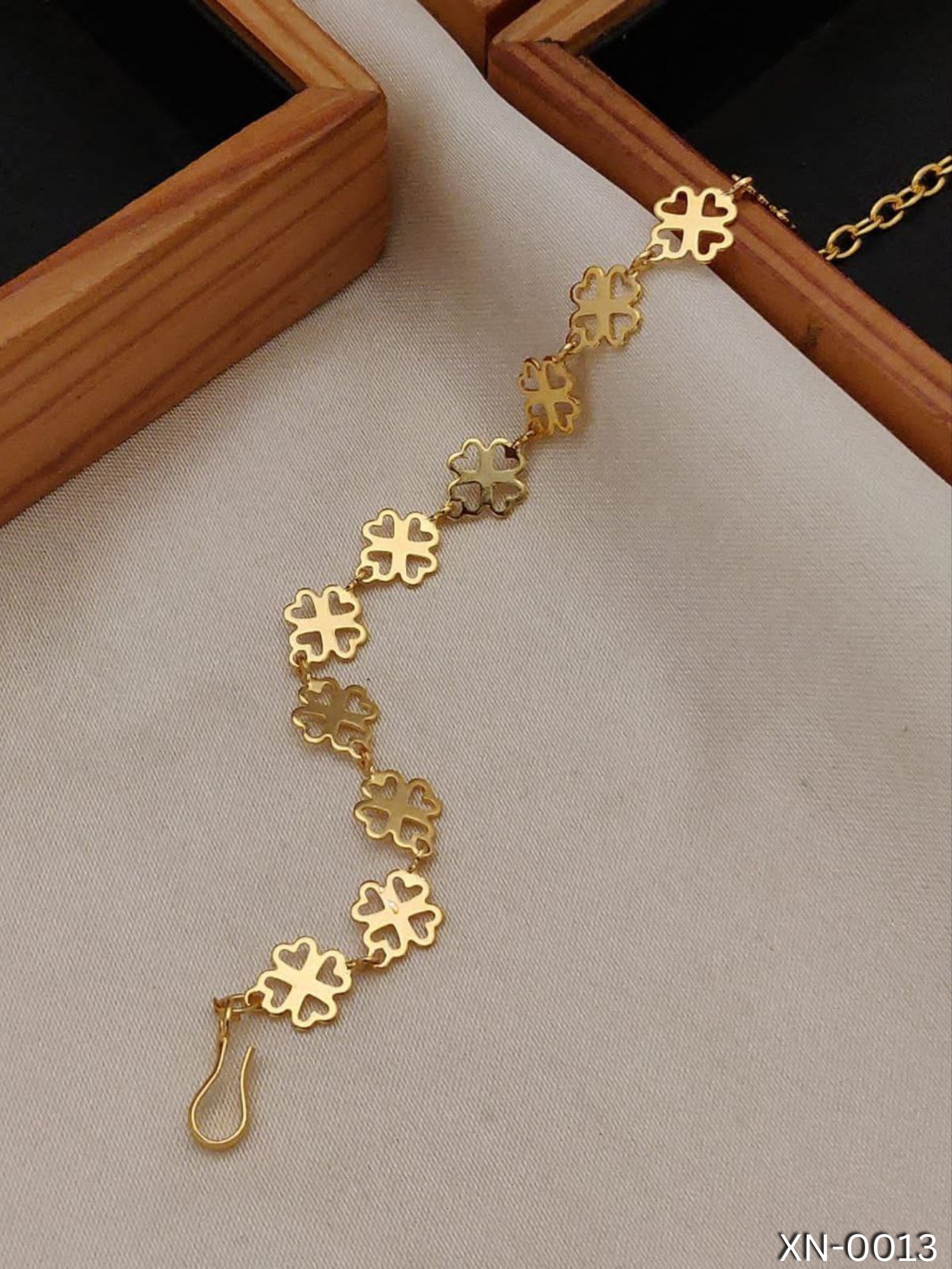 KANAF Radiant Blossom Gold-Plated Bracelet: Adjustable Elegance with Four Hearts - Timeless Style for Every Occasion.