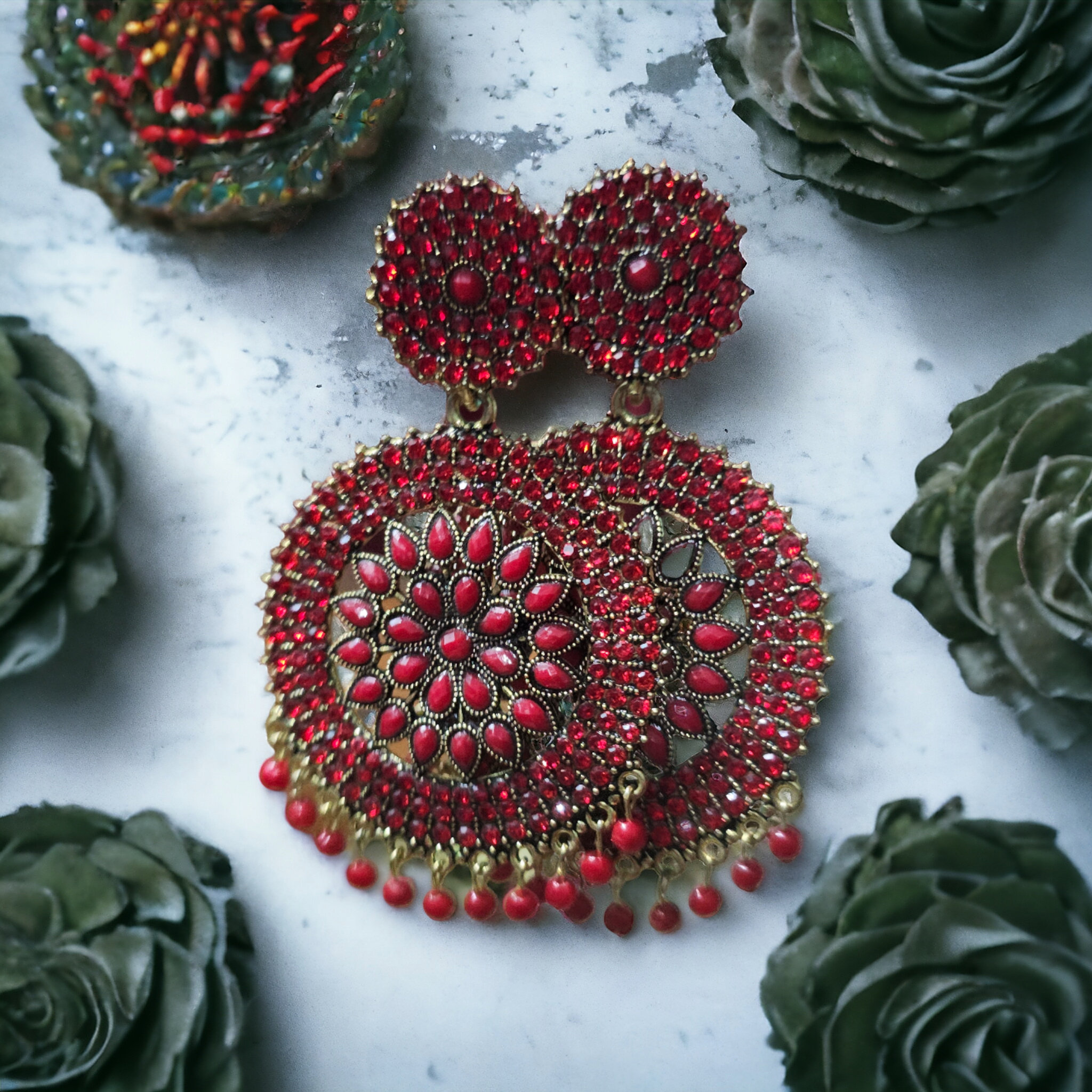 Jeweriche Imitation Elite Stone Gola Design Earrings ( Gola Stone )Base Metal : AlloyPlating : Gold PlatedSizing : AdjustableStone Type : Artificial Stones & BeadsType : ChandelierNet Quantity (N) : 1A pair of beautiful Stone Style Circular Design Earrings .Country of Origin : India - Red