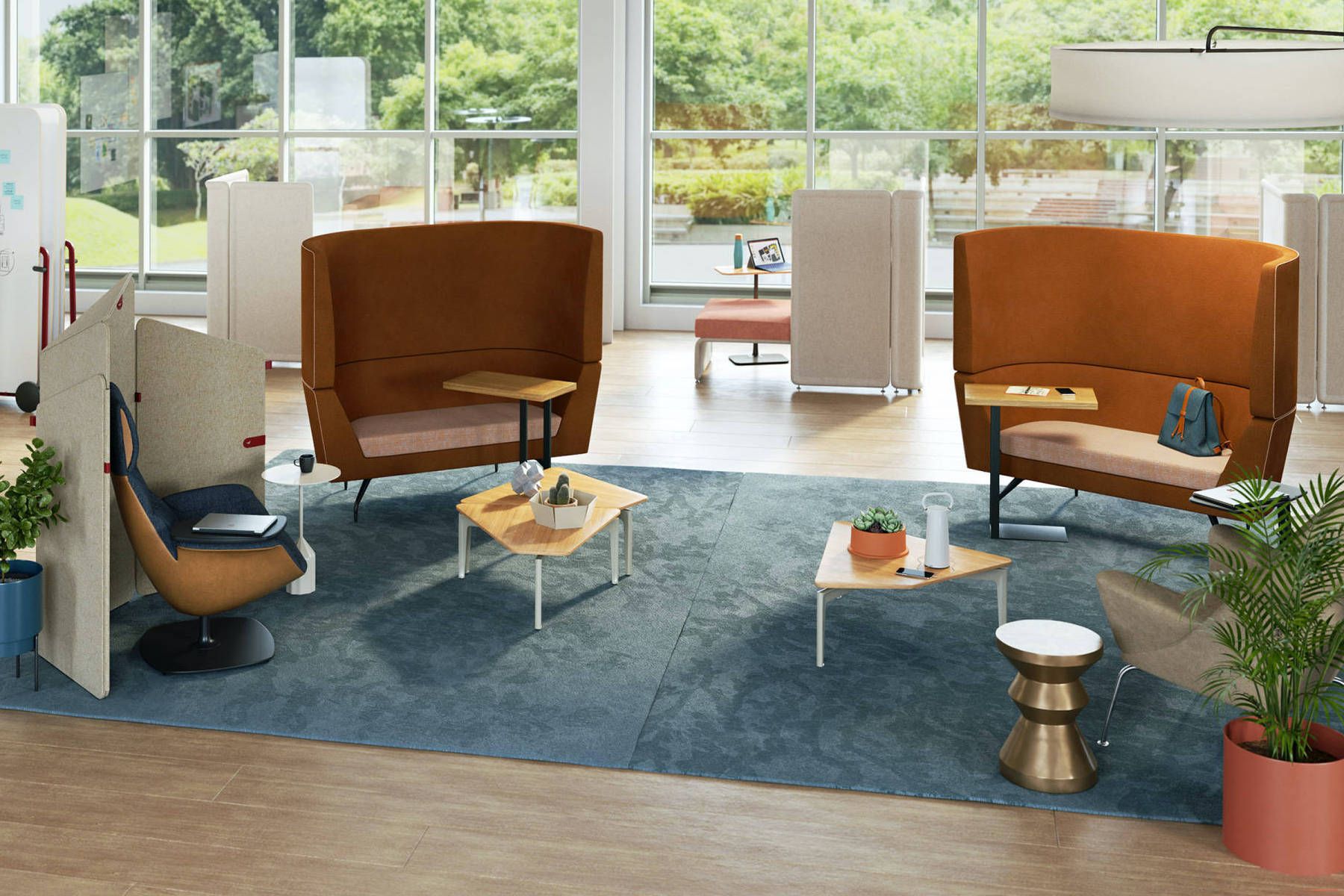 Photograph of a stylish office space that resembles a living room. There are plants, natural light coming in from a window, and cozy furniture.