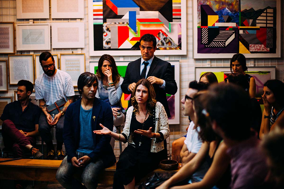 Photograph of a group of people having a discussion.
