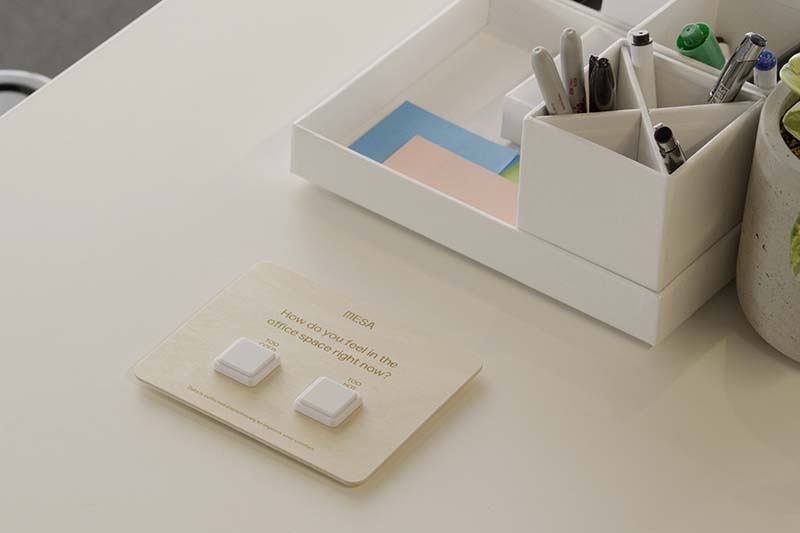 Mesa's comfort buttons displayed on an office desk