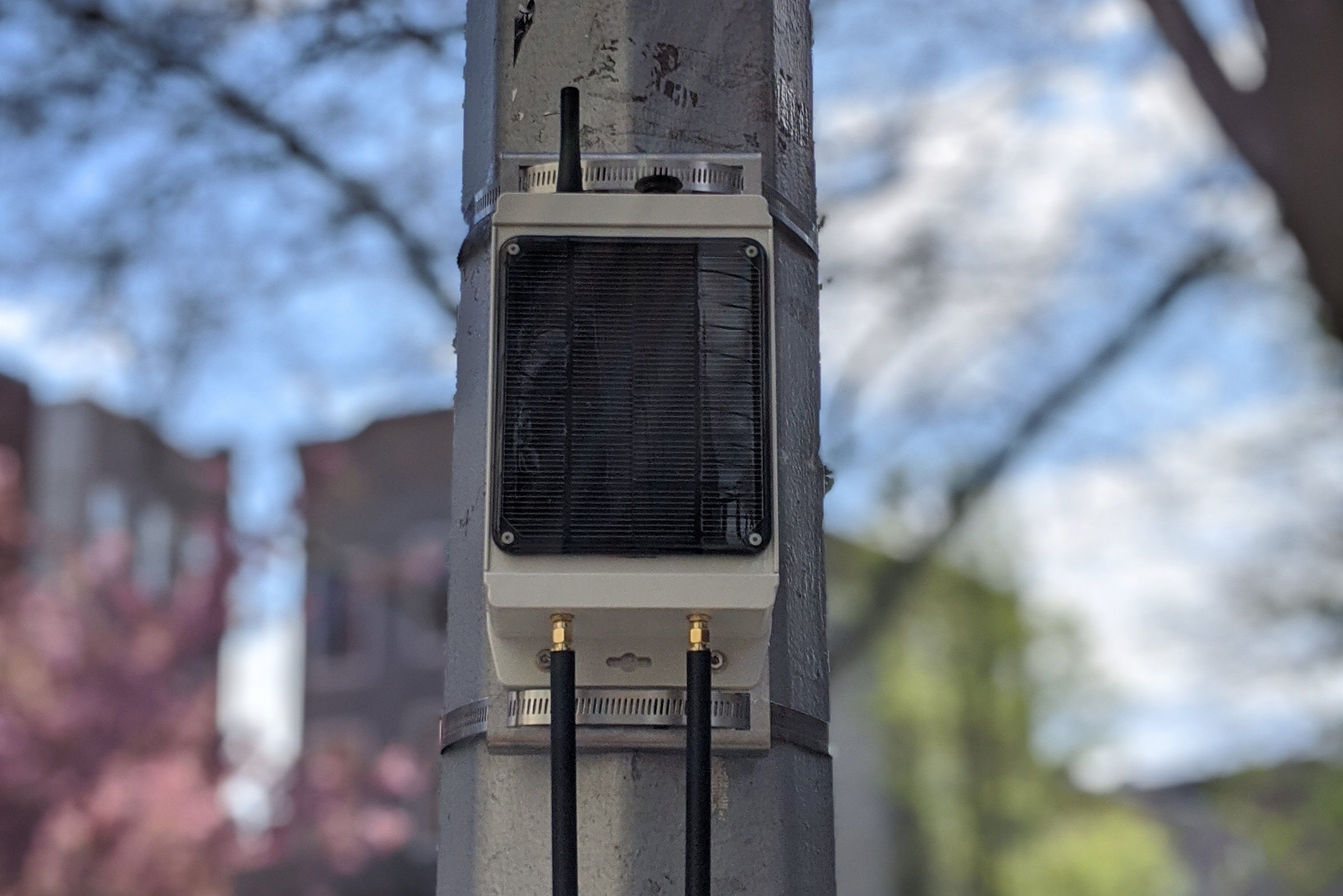 A photo of a Pebble gateway strapped to a utility pole