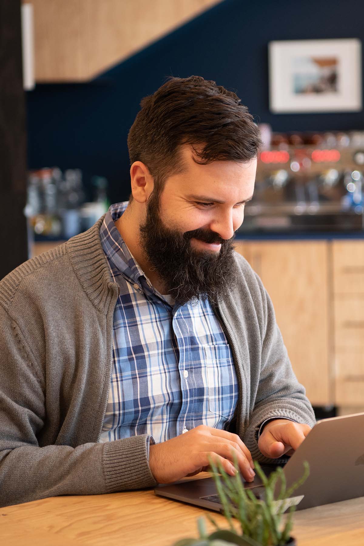 A Sidewalk employee types at his laptop