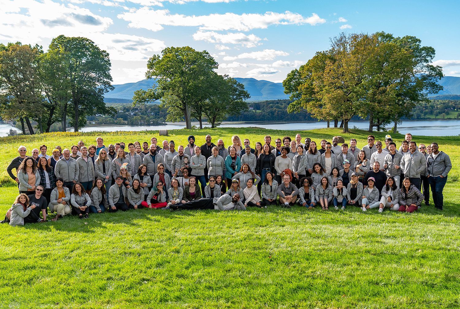 The Sidewalk team poses in a field